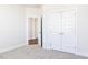 Bedroom showcasing carpet, doors, white trim, and an open doorway, enhancing its appeal at 674 Barbour Farm Ln, Four Oaks, NC 27524