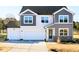 Beautiful two-story home with gray and white siding and an attached two-car garage at 674 Barbour Farm Ln, Four Oaks, NC 27524