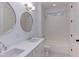 Double vanity bathroom with white cabinets and subway tile at 8780 Old Nc 86, Chapel Hill, NC 27516