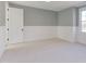 Bright bedroom with neutral walls and carpeting at 8780 Old Nc 86, Chapel Hill, NC 27516
