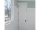 Bedroom with window and white door at 8780 Old Nc 86, Chapel Hill, NC 27516