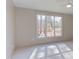 Bright bedroom with large window, hardwood floors, and shiplap wall at 8780 Old Nc 86, Chapel Hill, NC 27516