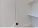 Walk-in closet with shelves and hanging rod at 8780 Old Nc 86, Chapel Hill, NC 27516