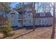 Two story light blue house with white accents and landscaping at 8780 Old Nc 86, Chapel Hill, NC 27516
