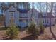 Two story light blue house with white accents and landscaping at 8780 Old Nc 86, Chapel Hill, NC 27516