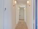 Light and bright hallway with hardwood floors and elegant wall sconces at 8780 Old Nc 86, Chapel Hill, NC 27516