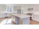 Modern kitchen with stainless steel appliances and white cabinets at 8780 Old Nc 86, Chapel Hill, NC 27516