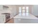 Modern kitchen with stainless steel appliances and white cabinetry at 8780 Old Nc 86, Chapel Hill, NC 27516