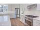 Modern kitchen with stainless steel appliances and white cabinets at 8780 Old Nc 86, Chapel Hill, NC 27516