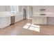 Modern kitchen, stainless steel appliances, and hardwood floors at 8780 Old Nc 86, Chapel Hill, NC 27516