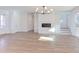 Bright living room with hardwood floors, fireplace and access to porch at 8780 Old Nc 86, Chapel Hill, NC 27516