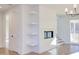 Living room with fireplace, built-in shelves, hardwood floors at 8780 Old Nc 86, Chapel Hill, NC 27516