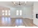 Open living room with hardwood floors and French doors at 8780 Old Nc 86, Chapel Hill, NC 27516