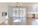 Bright living room with hardwood floors, fireplace and access to porch at 8780 Old Nc 86, Chapel Hill, NC 27516