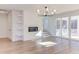 Bright living room with hardwood floors, fireplace and access to porch at 8780 Old Nc 86, Chapel Hill, NC 27516