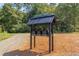 Modern black mailboxes with the name Beacon, nestled in a wooded area at 8780 Old Nc 86, Chapel Hill, NC 27516