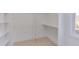 Spacious walk-in closet with custom shelving and hanging rod at 8780 Old Nc 86, Chapel Hill, NC 27516