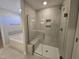Spa-like bathroom with soaking tub and walk-in shower at 1109 Prominence Dr., Homesite 17, Durham, NC 27712