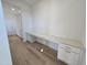 Laundry room with built in cabinets and workspace at 1109 Prominence Dr., Homesite 17, Durham, NC 27712