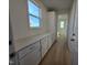 Bright laundry room with built-in cabinets and countertop at 1109 Prominence Dr., Homesite 17, Durham, NC 27712