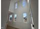 Bright two-story foyer with hardwood floors and numerous windows at 1109 Prominence Dr., Homesite 17, Durham, NC 27712