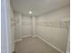 Large walk-in closet with wire shelving at 1109 Prominence Dr., Homesite 17, Durham, NC 27712