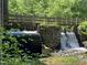 Historic water mill with wooden wheel and stonework at 1109 Prominence Dr., Homesite 17, Durham, NC 27712