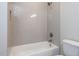 Stylish bathroom with a tub and shower featuring patterned tile walls at 81 Autumn Gate St, Pittsboro, NC 27312