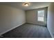 Spacious bedroom with carpeted floor and a window at 99 Mapledale Ct, Benson, NC 27504