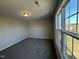 Well-lit bedroom with a large window offering scenic views at 99 Mapledale Ct, Benson, NC 27504