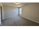 Bright bedroom with carpeted floor and large window at 99 Mapledale Ct, Benson, NC 27504