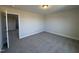 Bedroom with an open door revealing access to another room at 99 Mapledale Ct, Benson, NC 27504