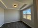 Bright bedroom with large window and neutral walls at 99 Mapledale Ct, Benson, NC 27504