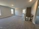 Spacious bonus room with carpet and multiple windows at 99 Mapledale Ct, Benson, NC 27504
