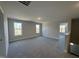 Spacious bonus room with carpet and multiple windows at 99 Mapledale Ct, Benson, NC 27504