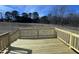 Wooden deck overlooking a large backyard at 99 Mapledale Ct, Benson, NC 27504