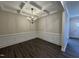 Elegant dining room featuring a chandelier and wainscoting at 99 Mapledale Ct, Benson, NC 27504