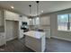 Modern kitchen with white cabinets and an island at 99 Mapledale Ct, Benson, NC 27504