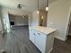 Modern kitchen with island and stainless steel appliances at 99 Mapledale Ct, Benson, NC 27504