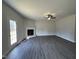 Spacious living room with corner fireplace and hardwood floors at 99 Mapledale Ct, Benson, NC 27504