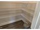 Well-equipped pantry with ample shelving for storage at 99 Mapledale Ct, Benson, NC 27504