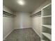 Spacious walk-in closet with built-in shelving and hanging rods at 99 Mapledale Ct, Benson, NC 27504