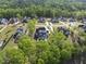 This aerial view shows a neighborhood with mature trees and well maintained landscaping at 7417 Dover Hills Dr, Wake Forest, NC 27587