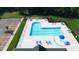 Aerial view of community pool with splash fountain, lounge chairs, and landscaping at 7417 Dover Hills Dr, Wake Forest, NC 27587