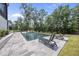 Beautiful backyard pool featuring a lounge area and modern design, perfect for relaxation and outdoor entertaining at 7417 Dover Hills Dr, Wake Forest, NC 27587
