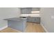 Entertainment wet bar featuring custom cabinets, counter, backsplash, and modern appliances for hosting and relaxation at 7417 Dover Hills Dr, Wake Forest, NC 27587