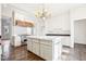 Spacious kitchen with white cabinets and marble island at 728 W Davis St, Burlington, NC 27215