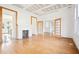 Living room with hardwood floors and fireplace, open to other areas at 728 W Davis St, Burlington, NC 27215