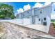 Townhome backyard features a concrete patio area, enclosed by a white fence for added privacy at 98 Linda St, Princeton, NC 27569