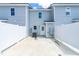 Backyard patio area enclosed by a white fence and the light gray siding of the townhome at 98 Linda St, Princeton, NC 27569